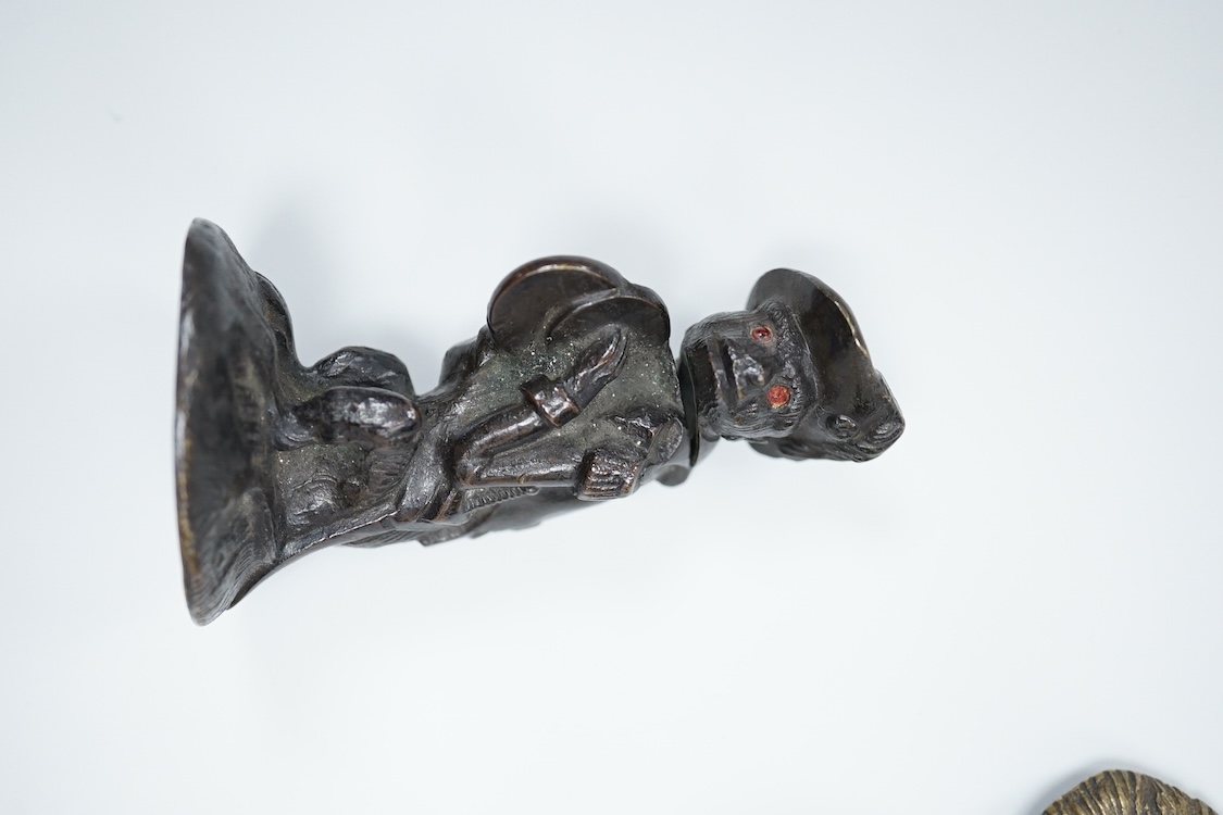 A novelty dog's head Pastille burner and bronze monkey, largest 11cm wide